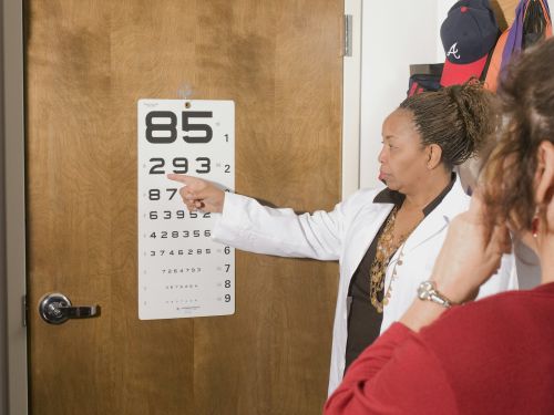 Dr administering eye exam