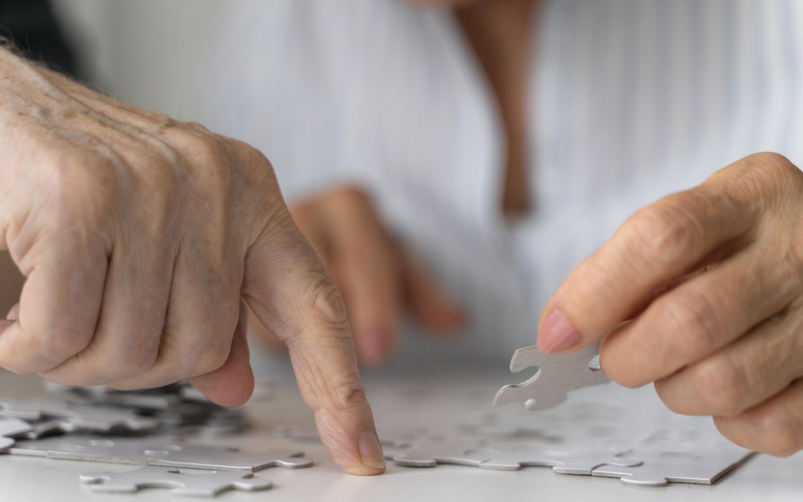 Hands with a puzzle