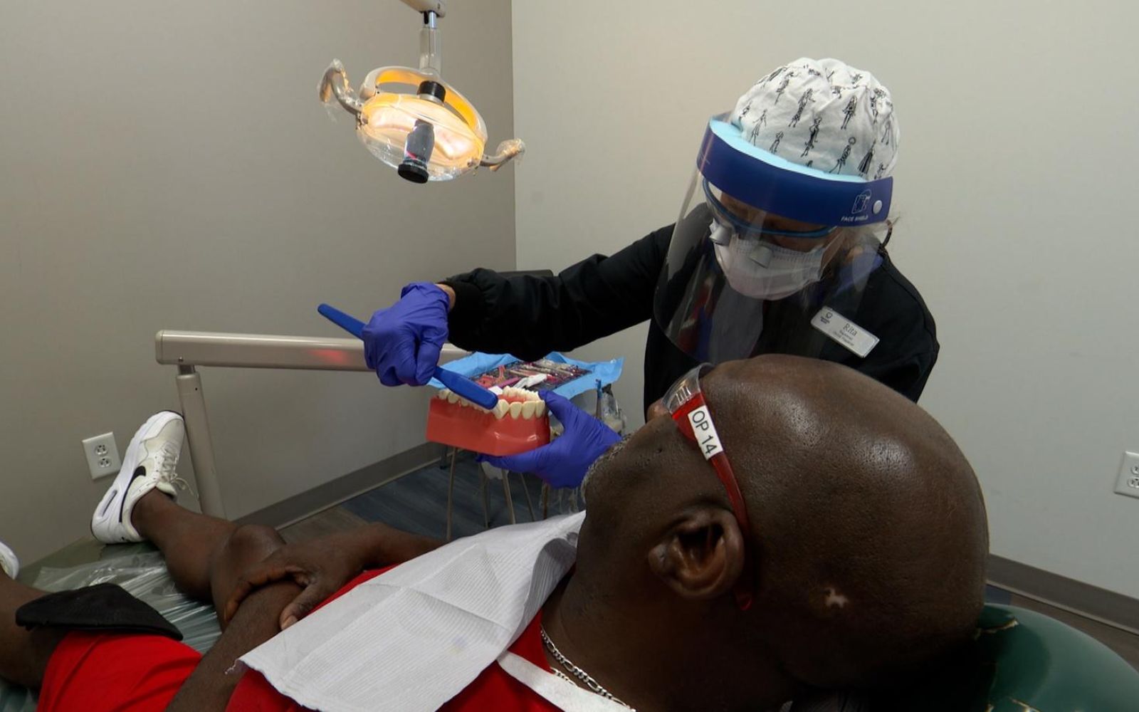 Dentist assisting patient at Nashville General