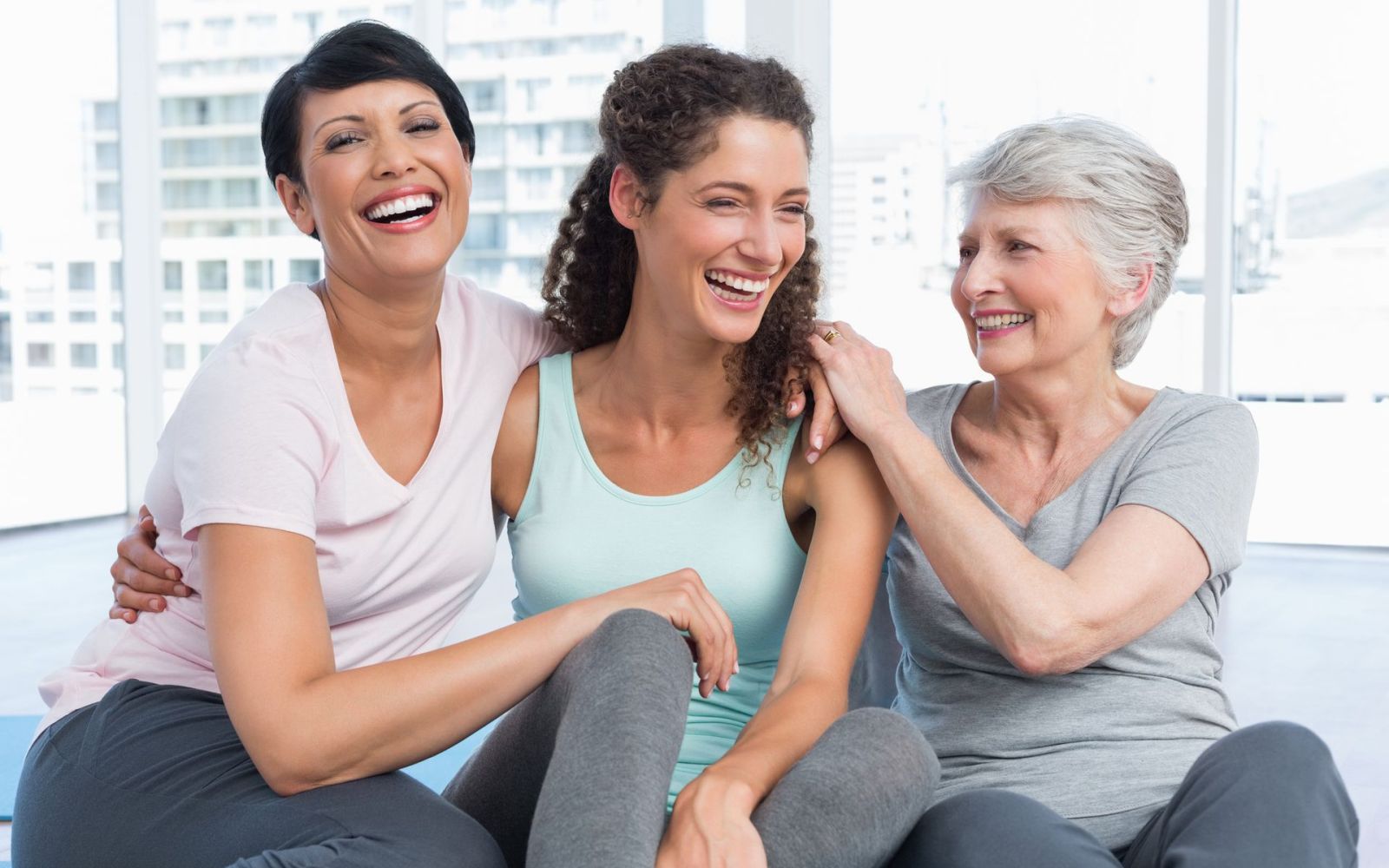 Three women in workout clothes