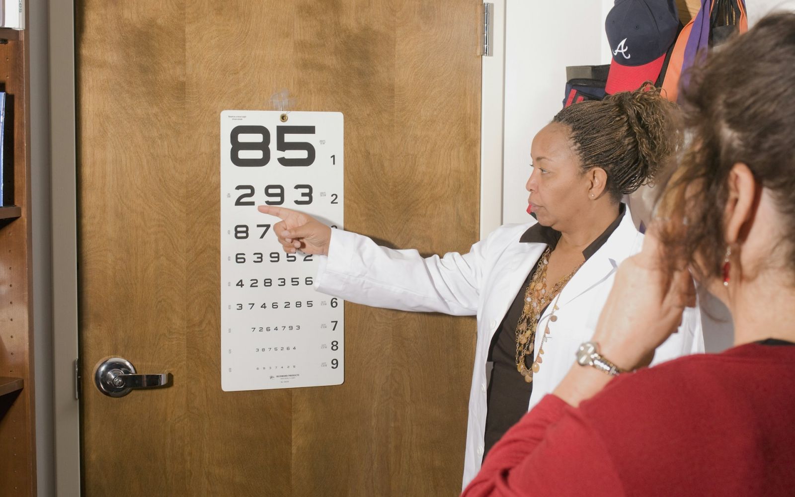 opthalmologist administering eye exam