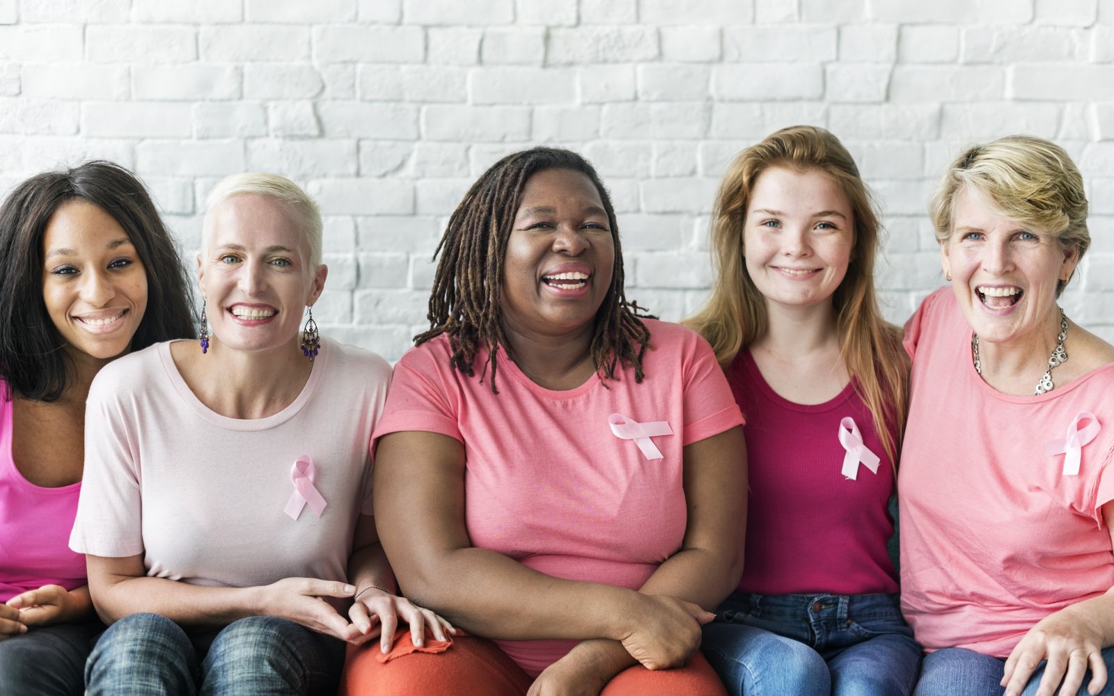 women wearing breast cancer awareness ribbons