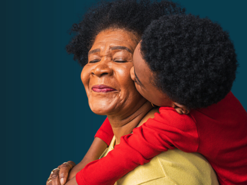 grandchild hugs grandmother