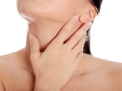 woman touching neck
