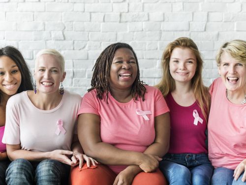 women wearing breast cancer awareness ribbons