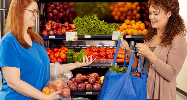 helping a visitor to the food pharmacy