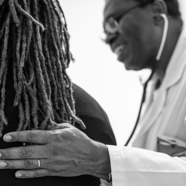 Physician comforts a patient