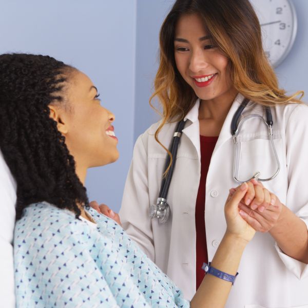 female doctor talking with a female patient