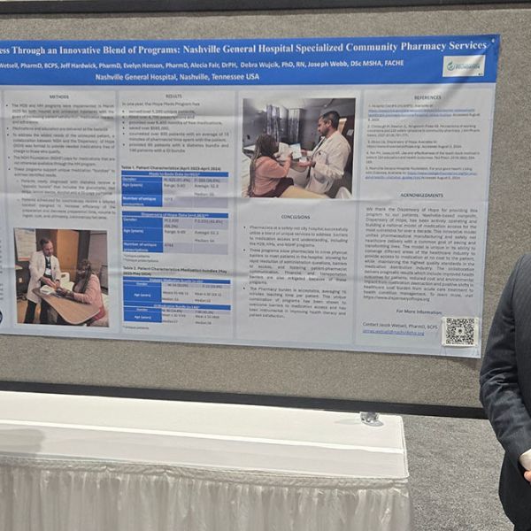 Jeff Hardwick, PharmD (left) and Jacob Wetsell, PharmD, BCPS (right) at the poster presentation during the American Society of Health-System Pharmacists (ASHP) Midyear 2024 Clinical Meeting & Exhibition in New Orleans, Louisiana.