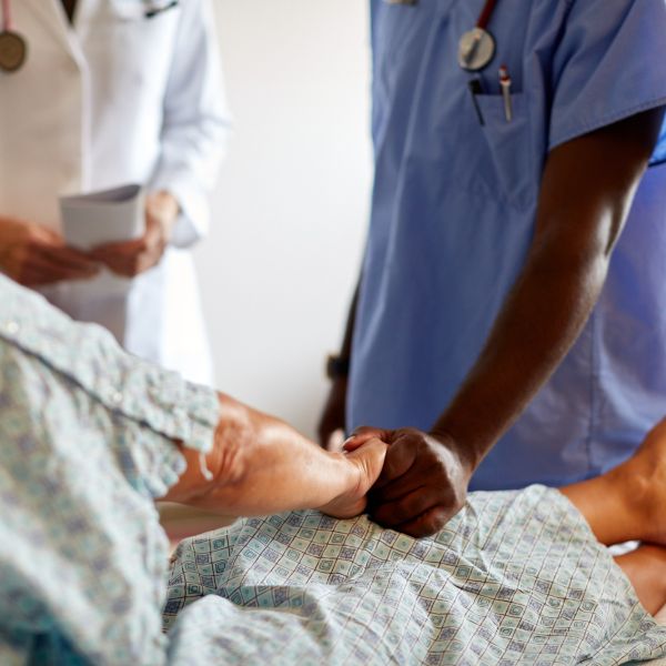 image of doctors visiting patient