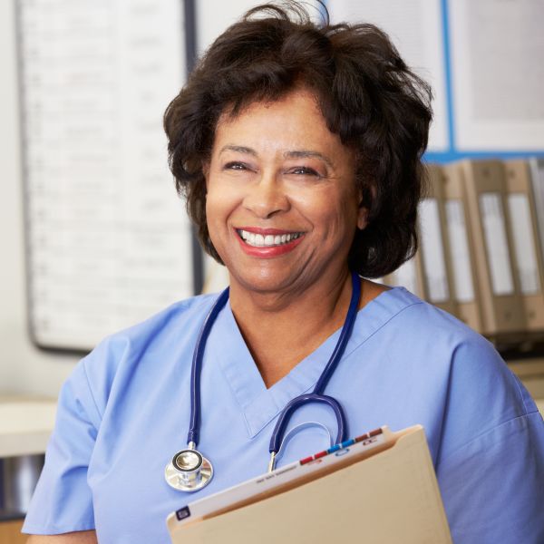 Female physician in a hospital smiling