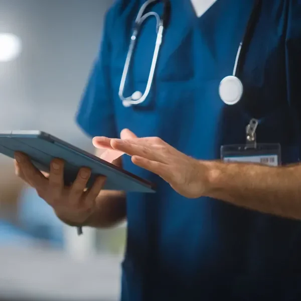 Healthcare provider looking at a tablet