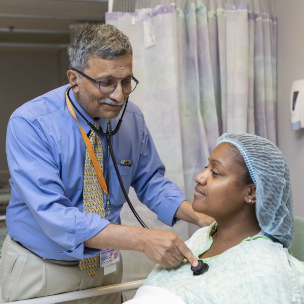 Dr. Malaikkal with a patient