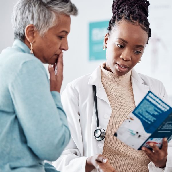 doctor and patient looking at a pamphlet