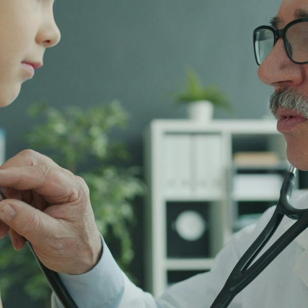 dr checking child with stethoscope. photo: http://unsplash.com/@silverkblack