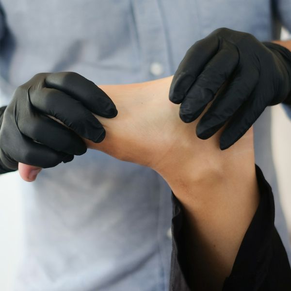 physician examining foot