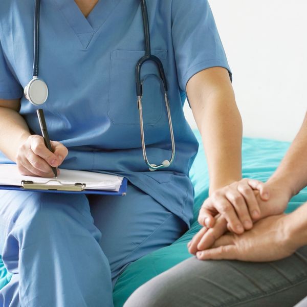 Image of a doctor reassuring a patient